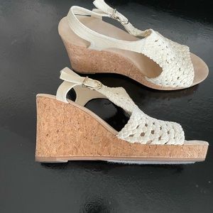 Cream colored cork hi heel sandals.  Wore once for a wedding.